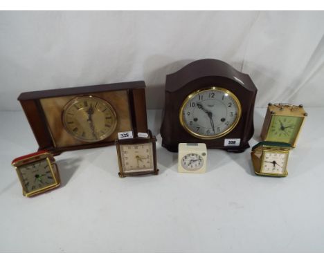 A Smiths mantel clock, Bakelite case with silvered dial, Arabic numerals, hour and half-past gong striking movement, together