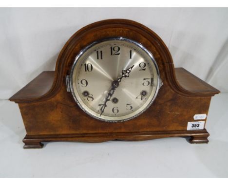 A walnut veneer Westminster chime mantel clock, silvered dial with Arabic numerals with key and pendulum - This lot MUST be p