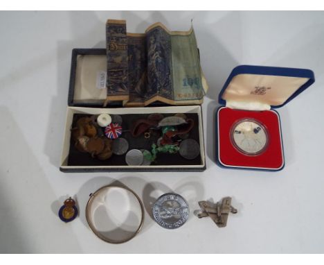 A good mixed lot to include a silver hallmarked expanding bangle, a Royal Commemorative Silver coin, Civil Defense Corps enam