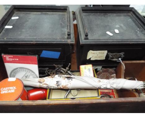 A mixed lot to include two wooden miniature sets of drawers, vintage tins, hand tools, brushes, umbrella and other   - This l