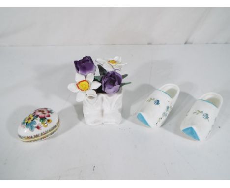 Coalport - a pair of miniature ceramic clogs, a miniature floral egg dish in the Ming Rose pattern and a pair of boots contai
