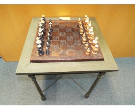 A table in the form of a chess board and card table with inset drawers containing ebony and ivory chess pieces circa 1940, ap