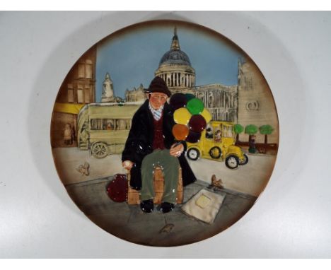Royal Doulton - a Royal Doulton charger entitled The Balloon Man, D6655 modelled by William K Harper, approximately 26 cm (d)