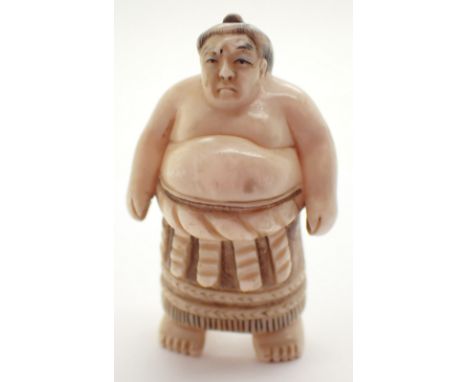 Antique ivory Netsuke of a Sumo wrestler signed to base H: 5 cm