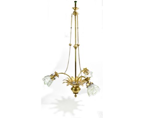 An Arts &amp; Crafts brass three branch ceiling light, the three frosted glass shades with trailed decoration, height 91cm.Ad