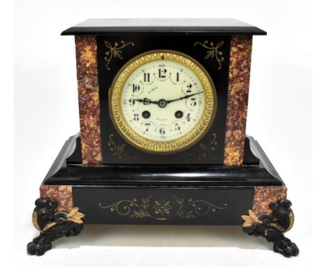 A Victorian slate and rouge marble mantel clock, the circular dial set with Roman, Arabic and baton numerals, raised on appli