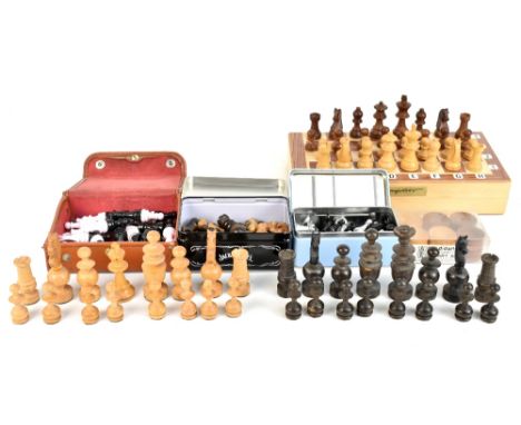 A stained and carved wooden chess set, height of king 6.5cm, a composite stained and turned wooden chess set, a further small