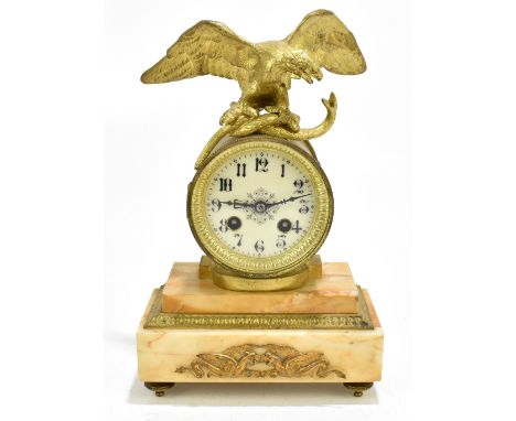 A 19th century French mantel clock with gilt metal and serpent eagle surmount above circular dial with Roman numerals, raised