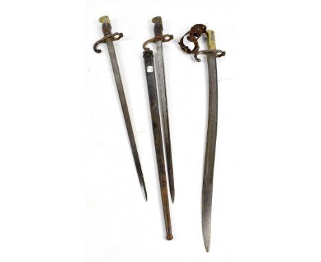 Three late 19th century French bayonets comprising unmarked Chassepot example, length 70cm, and two straight bladed examples 