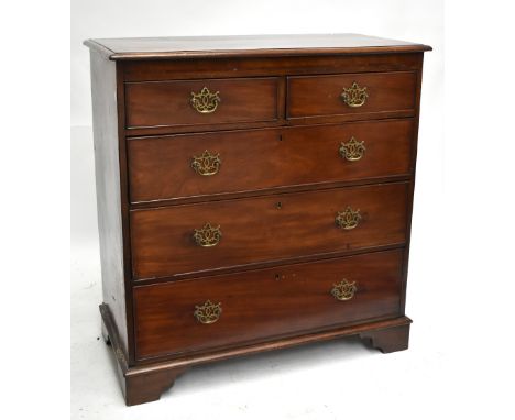 An early 19th century mahogany chest of two short over three long drawers, raised on bracket feet, length 97cm, depth 49.5cm,
