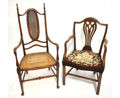 An Edwardian mahogany open sided armchair with caned back and seat, together with a Georgian urn back open sided armchair wit