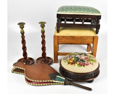 A Victorian footstool with tapestry top, diameter 27cm, together with two later footstools, a pair of oak barleytwist candles