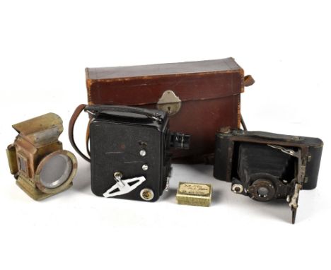 A Kodak No.2 folding camera, a further camera by Dekko and a small lamp (3).Additional InformationGeneral wear.