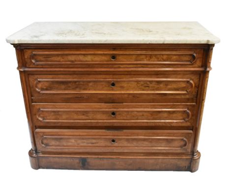 A mid to late 19th century French walnut four drawer commode, the shaped veined white marble top above four moulded graduated