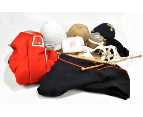 A group of uniforms for military re-enactments including a tropical helmet, khaki helmet and a Police-type helmet, a 19th cen