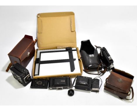 Four vintage cameras and cine cameras including Kodak and Siemens examples, also an enlarging easel mask.Additional Informati