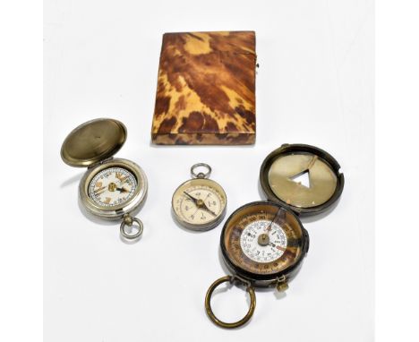 A late 19th century tortoiseshell card case, 10 x 7cm, also three compasses&nbsp;including two military examples, one marked 