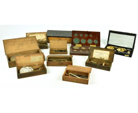 Nine sets of assorted scales to include cased examples, with associated weights.