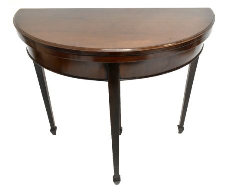 A mahogany demi-lune fold over card table, height 76cm, width 82cm.Additional InformationPronounced scrapes to legs, further 