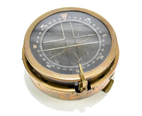 A Lancaster Bomber brass cased compass with plaque bearing military broad arrow and stamped '6A/1671', the upper disc stamped