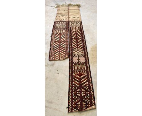 A Bokhara tent runner, purchased from Liberty London, now in two sections, the larger approx 384 x 44.5cm, the smaller approx