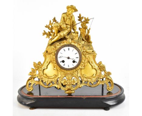 A 19th century French gilt spelter mantel clock with applied fisherman surmount above a circular enamelled dial set with Roma