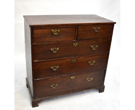 A Georgian oak chest of two short over three long drawers, on ogee bracket feet, height 86cm, width 85cm, depth 43cm.Addition