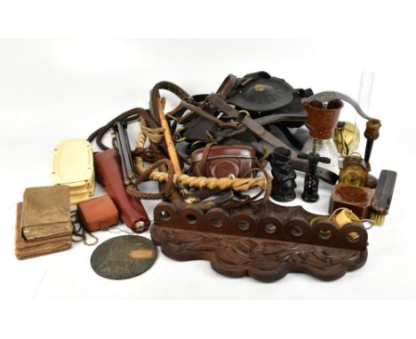 A group of collectors' items including a carved oak pipe rack, a Zeiss Ikon Contina camera, a bull's pizzle, riding crops, le