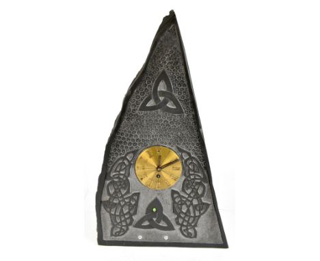 JAMES F MORGAN; a contemporary Welsh slate mantel clock of triangular form, with carved Celtic knots surrounding gilt metal d