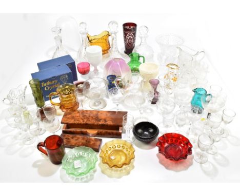 A quantity of decorative glass including a Bohemian ruby tinted vase, glass shade, small green glass jug, moulded ship's deca