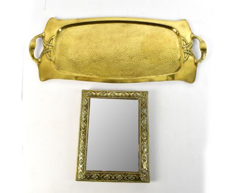 An Art Nouveau brass twin handled tray, the handles cast with floral detail flanking a central planished body,&nbsp;length 65