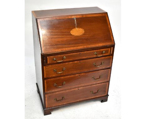 An Edwardian inlaid mahogany bureau, the fall front enclosing fitted compartments and three drawers above one short and three
