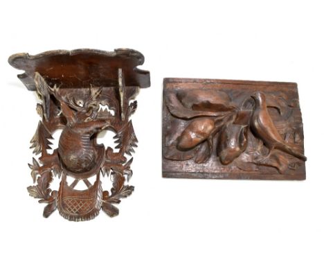 A Black Forest carved oak wall bracket decorated with a central stag, height 31cm, together with a carved oak panel, 23 x 31c