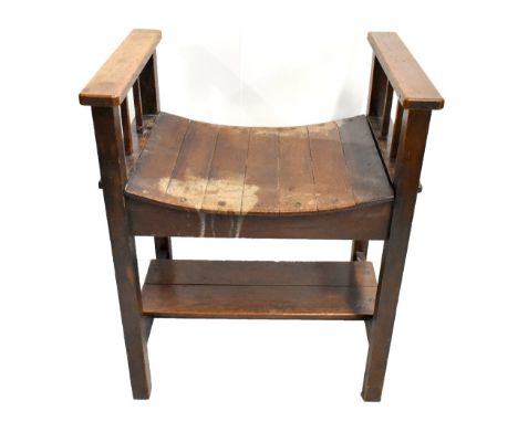 An Arts &amp; Crafts mahogany seat with slatted seat section, raised on block supports, height 68cm, width 55cm, depth 41cm.A