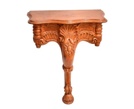 A stained oak serpentine fronted console table with elaborately carved knee, raised on oval shell foot, length 83cm, depth 52