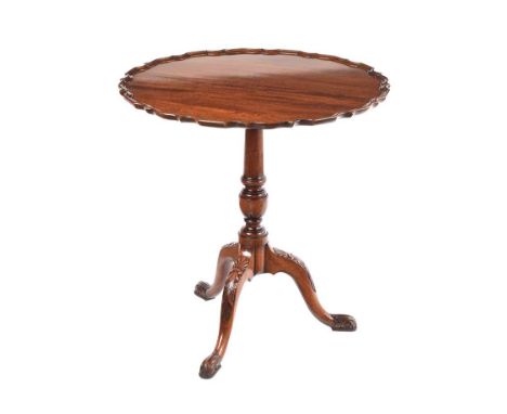 SCALLOPED EDGE MAHOGANY LAMP TABLE. RAISED ON THREE CARVED CABRIOLE LEGS WITH PAD FEET.HEIGHT: 28 INCHES.DIAMETER: 27 INCHES.