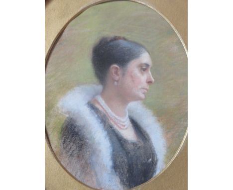 M.B. (XX). An oval portrait study of a lady with a pearl necklace, signed with monogram verso, watercolour, framed and glazed