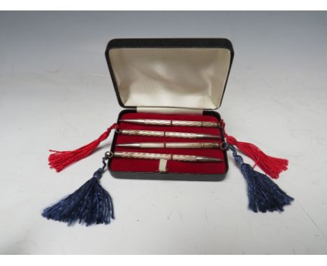 A CASED SET OF FOUR STERLING SILVER BRIDGE PENCILS