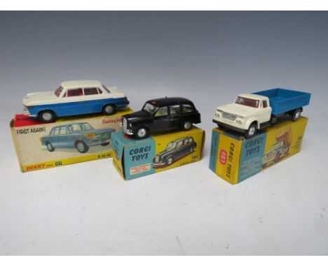 A VINTAGE BOXED DINKY CAR B.M.W. 2000 TILUX, together with two vintage boxed Corgi cars - an Austin taxi and a Dodge Kew Farg