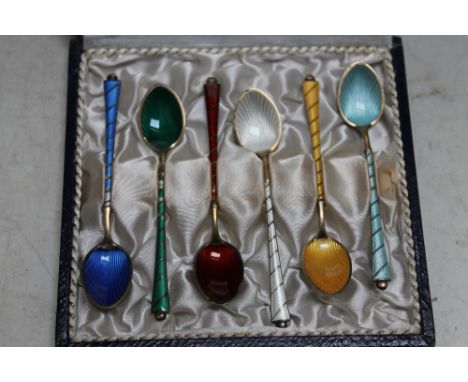 A CASED SET OF SIX HARLEQUIN ENAMEL SILVER GILT COFFEE SPOONS, stamped 'ELa Denmark STERLING 925 S, L 9.5 cmCondition Report: