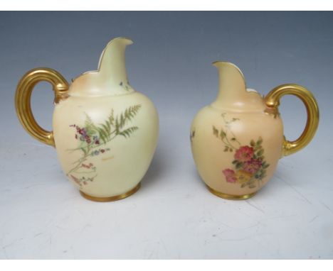 TWO  VINTAGE ROYAL WORCESTER CREAM / MILK JUGS, with flower decoration and gilt handles, Reg No. 29115, tallest H 14 cm (2)