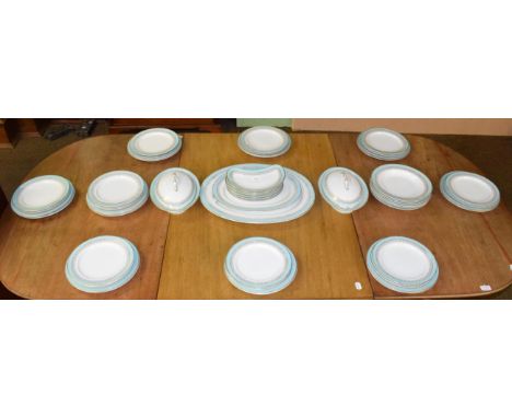 A Royal Worcester China Works part dinner service decorated with gilt and turquoise borders