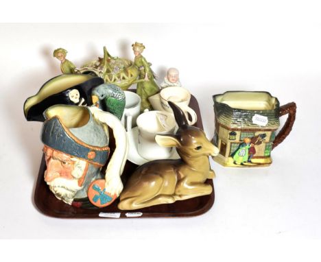 A tray including two Doulton jugs; Old Curiosity Shop jug; Midwinter figure of a fawn; German ceramics etc 