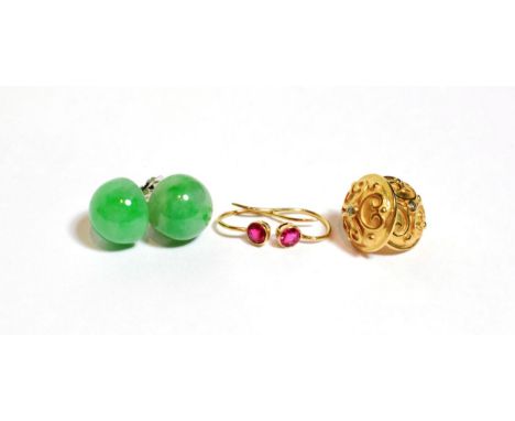 A pair of jade stud earrings, unmarked; a pair of red stone earrings, unmarked; and pair of 9 carat gold diamond set stud ear