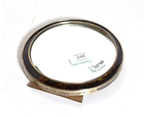 A George V silver and tortoiseshell mirror, Birmingham, 1918, circular and with easel back, as found, 17.5cm. diam. 