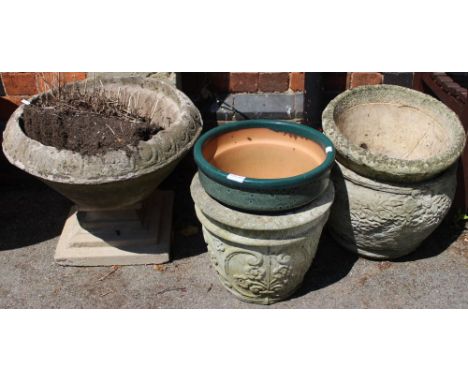 A green glazed garden planter, together with four reconstituted stone planters