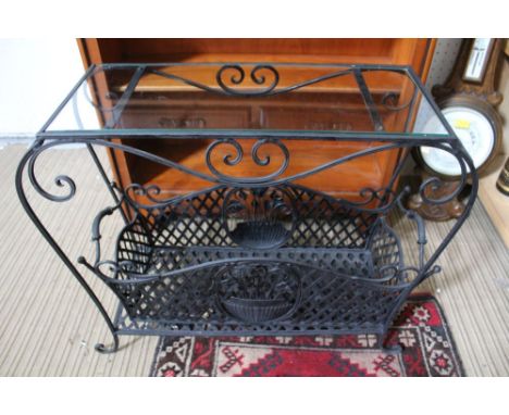 A French style garden planter / magazine rack with glass top