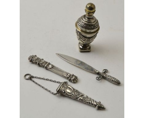 Four items of silver, includes a dagger shape bookmark, needle case, lidded urn and scissor holder (no scissors) from a chate