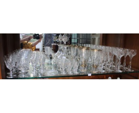 A shelf containing a vast selection of glassware, sets of eight hock glasses, eight champagne flutes, eight sherry, eight por