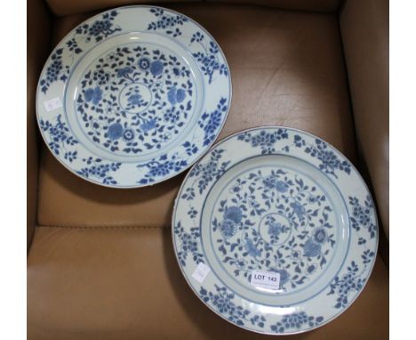 A pair of 18th century Chinese porcelain plates, hand painted floral decoration, 27cm dia (2) One plate  - Two chips to rimOn
